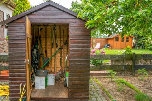 Prefabricated composite and recycled-content outdoor storage buildings retailers comparison: Lowe's vs Menard's